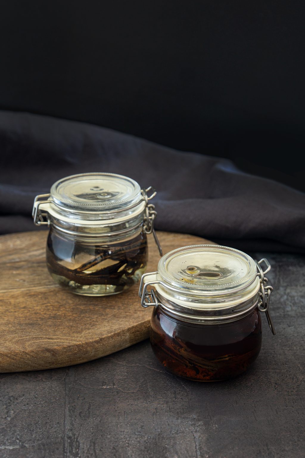 Homemade vanilla extract in small jars