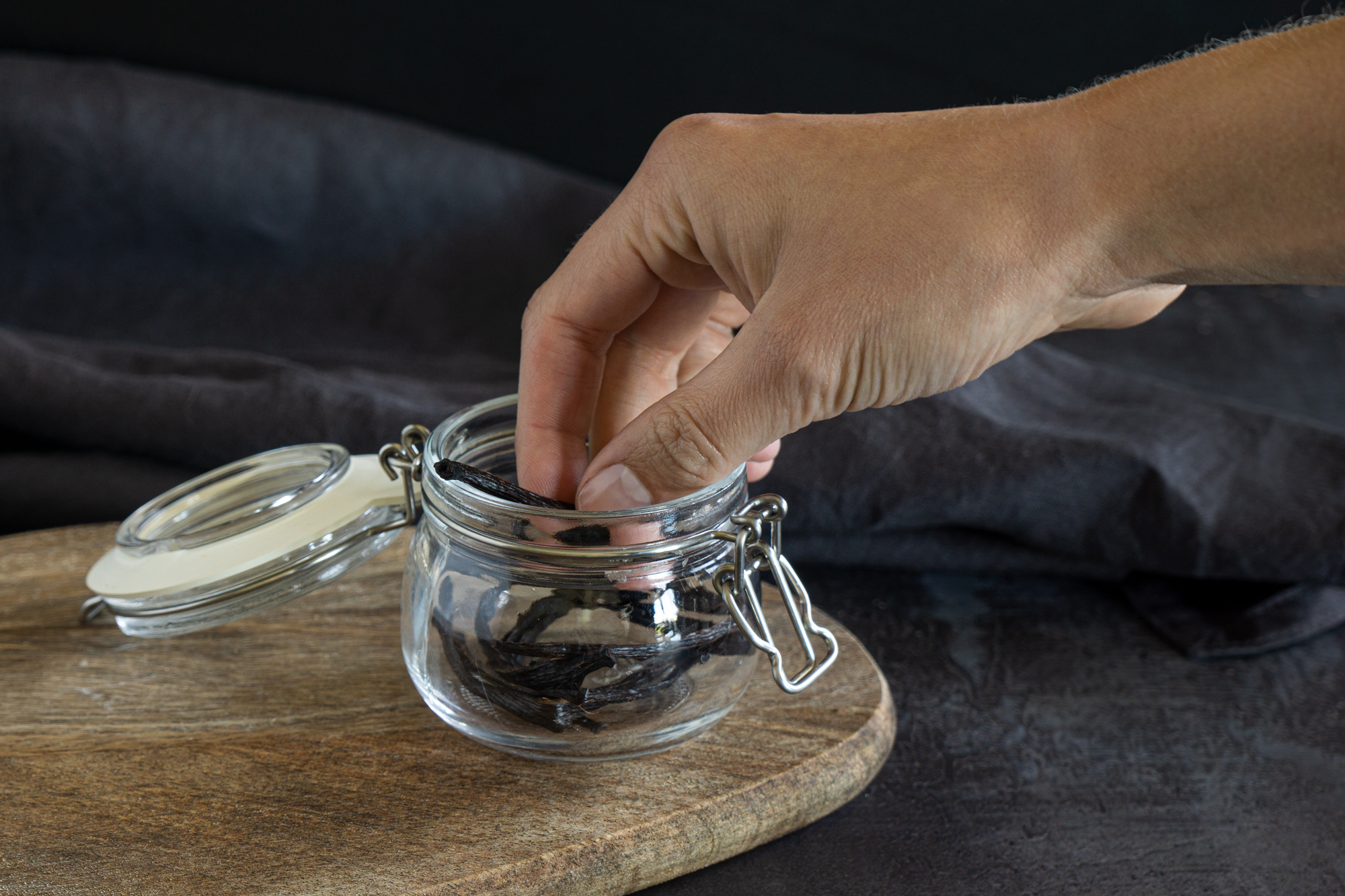 Putting vanilla beans to the glass jar