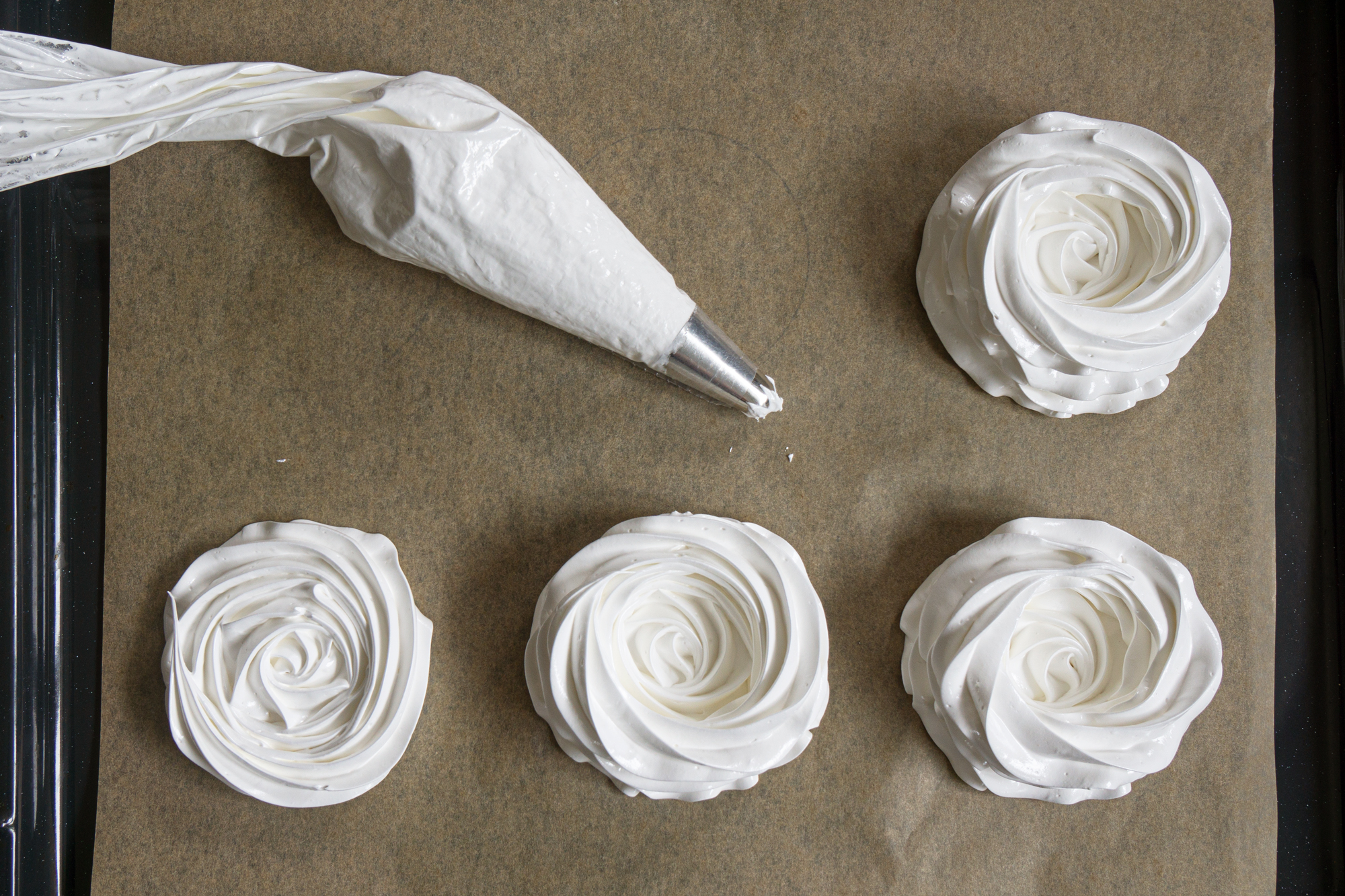 Pipe meringue nests with a piping bag