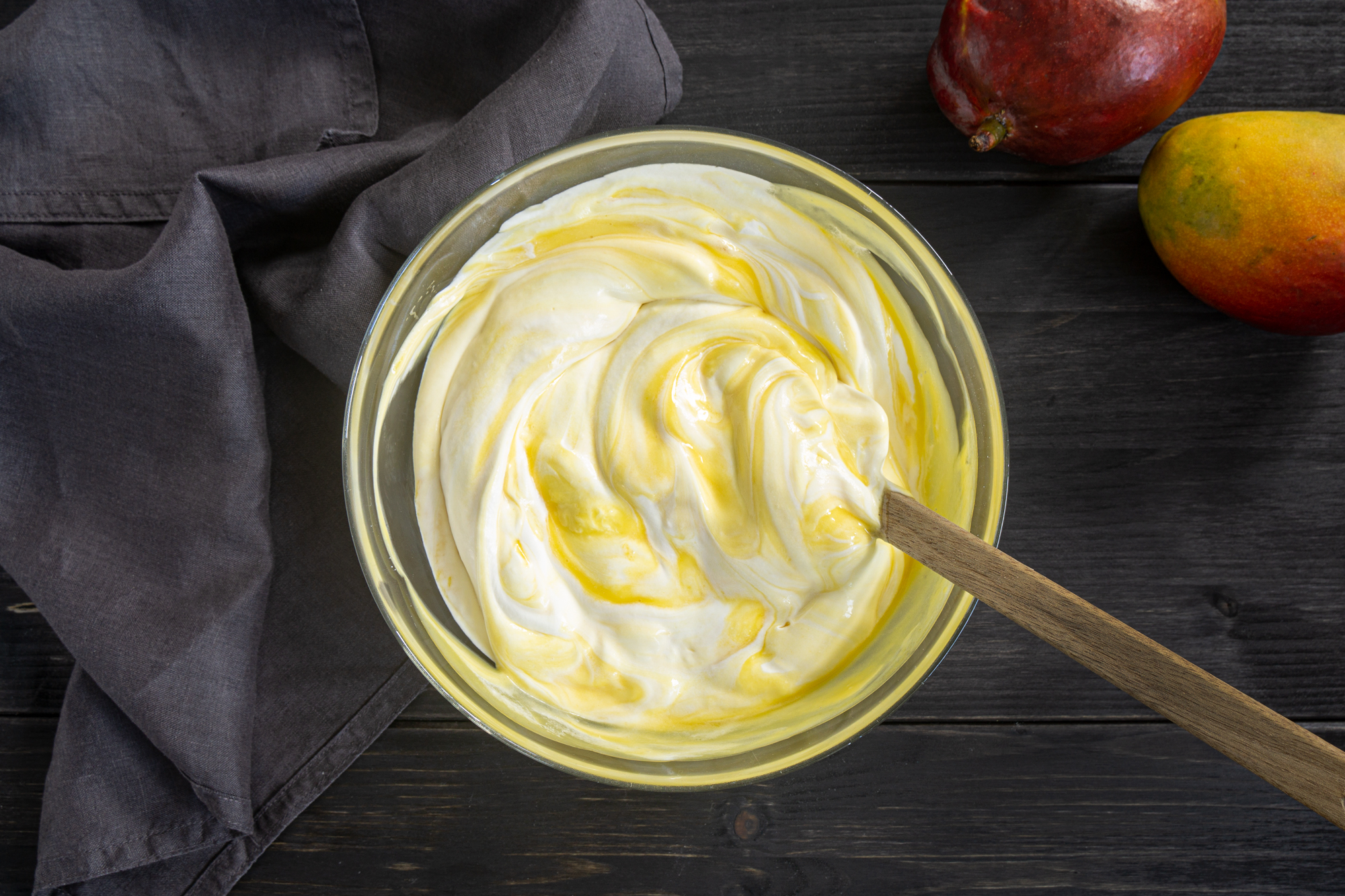 Mixing whipped cream with mango puree