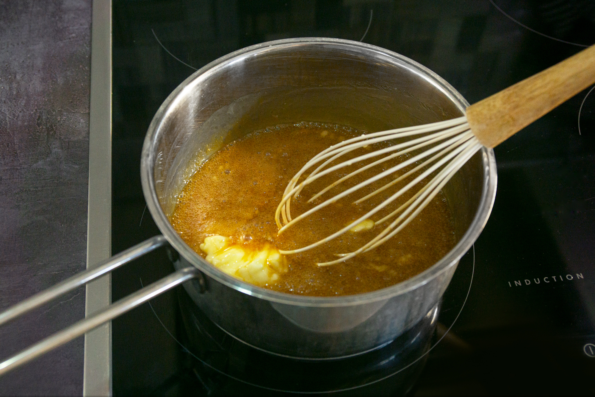 Adding butter to caramel sauce