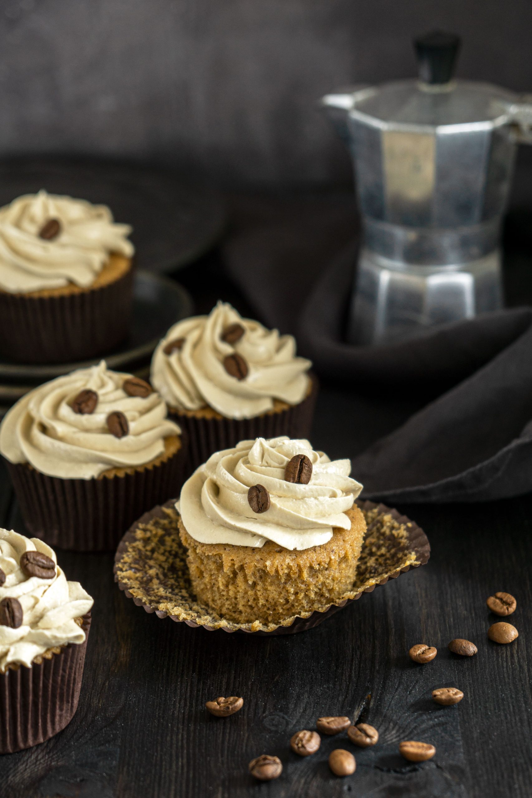 Coffee cupcakes on a dark moody background