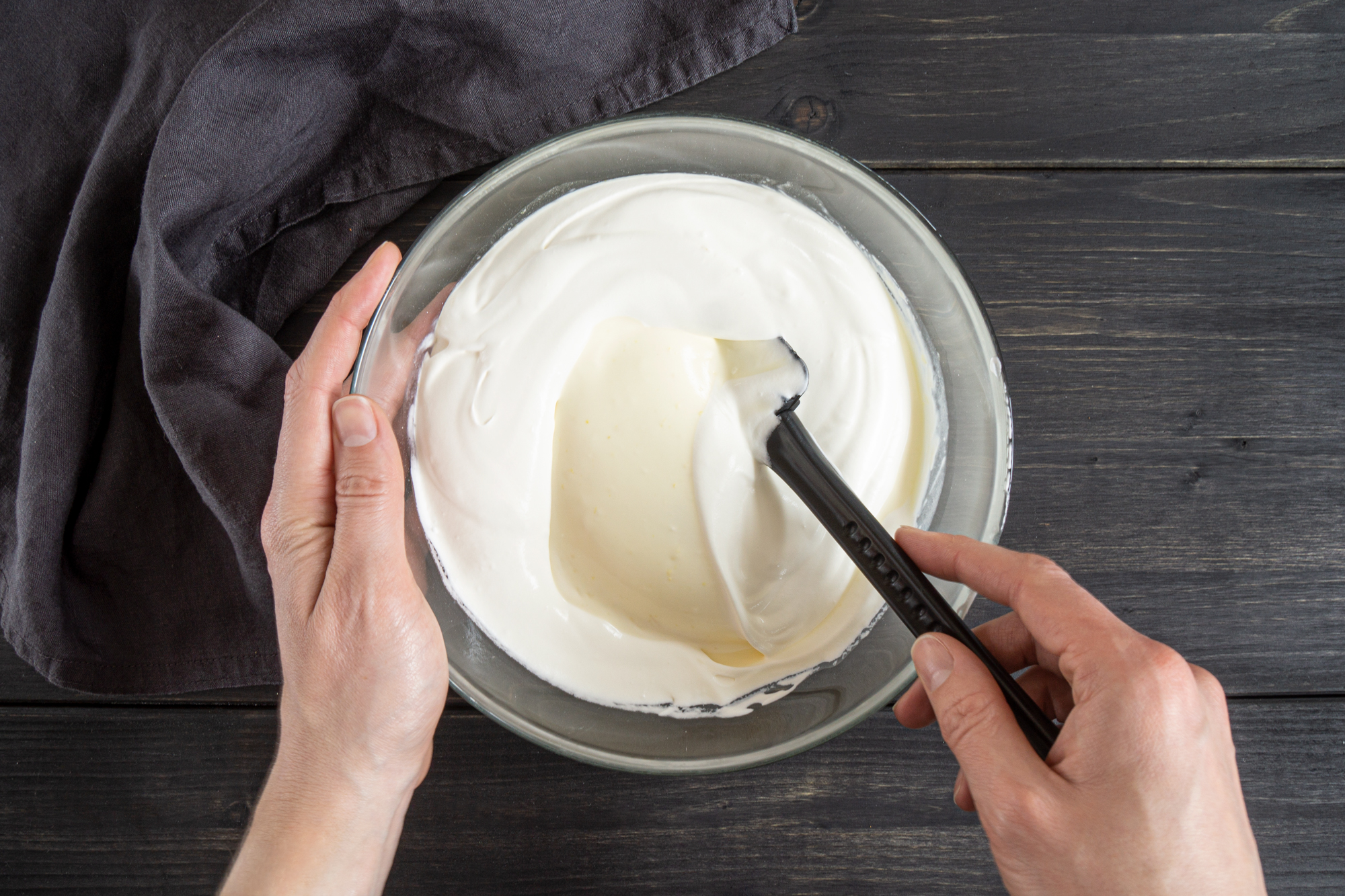 Folding in whipped cream into sour cream by hand