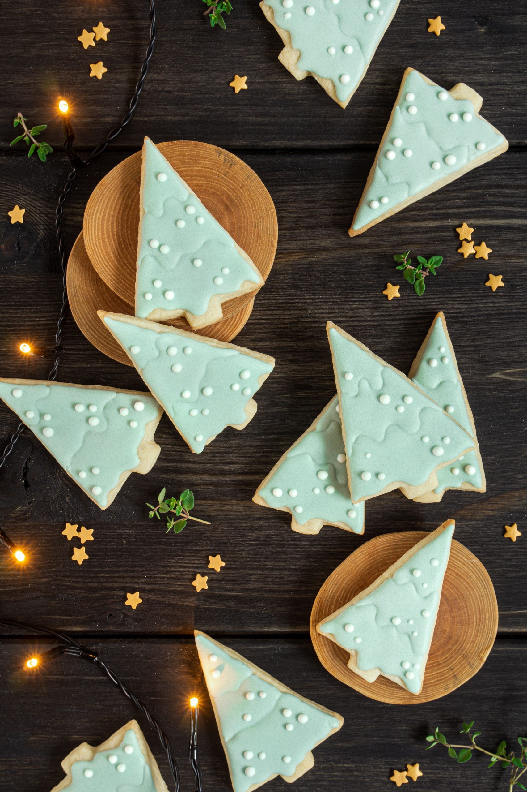 Fir tree shaped sugar cookies, decorated with mint color royal icing
