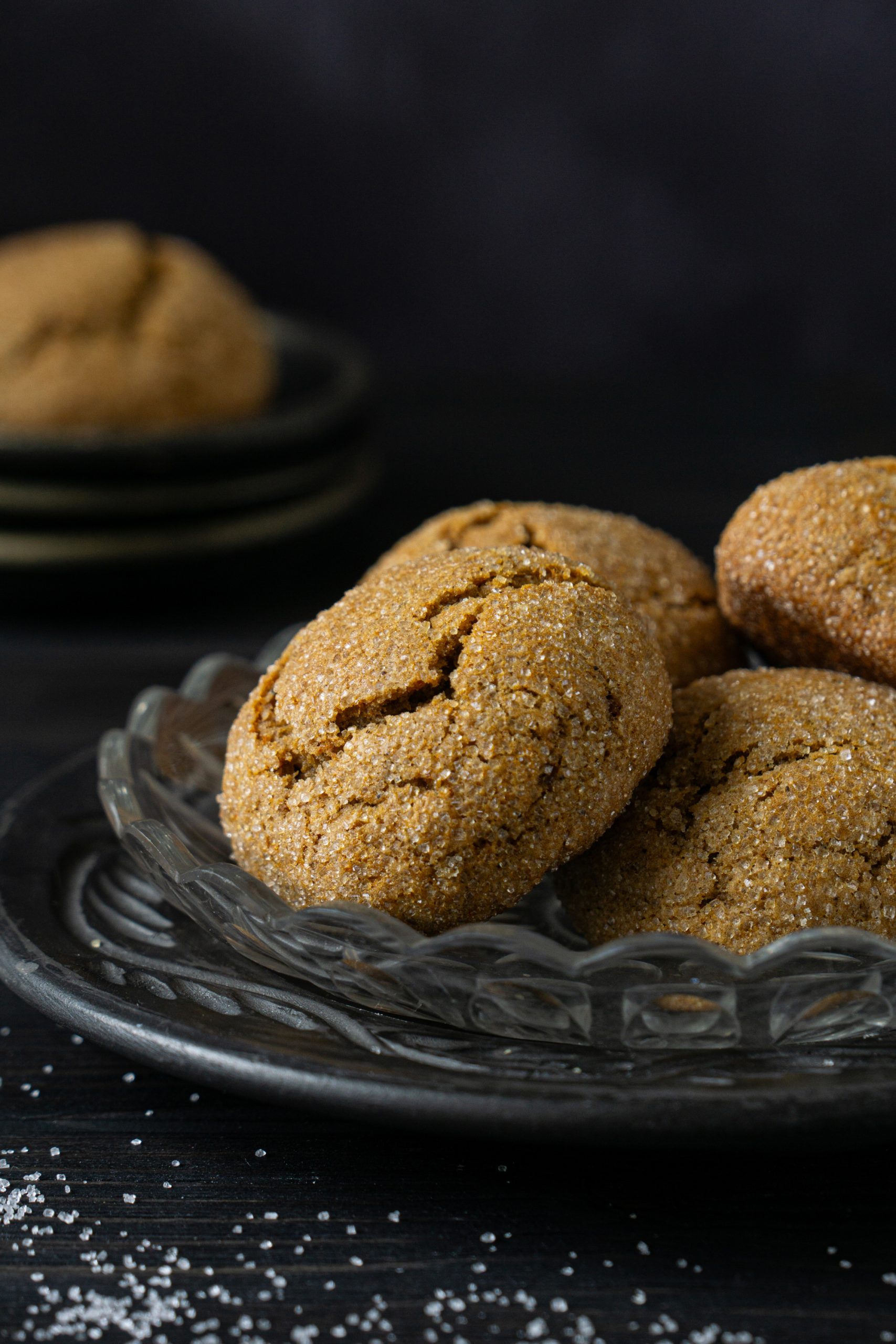Close up of cakey honey cookies on a dark background