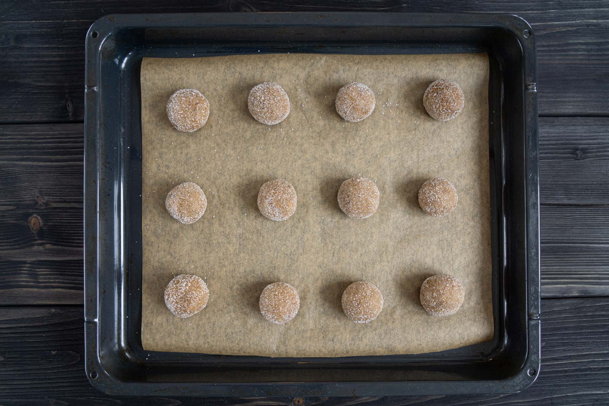 Honey cookie dough balls on a baking sheet