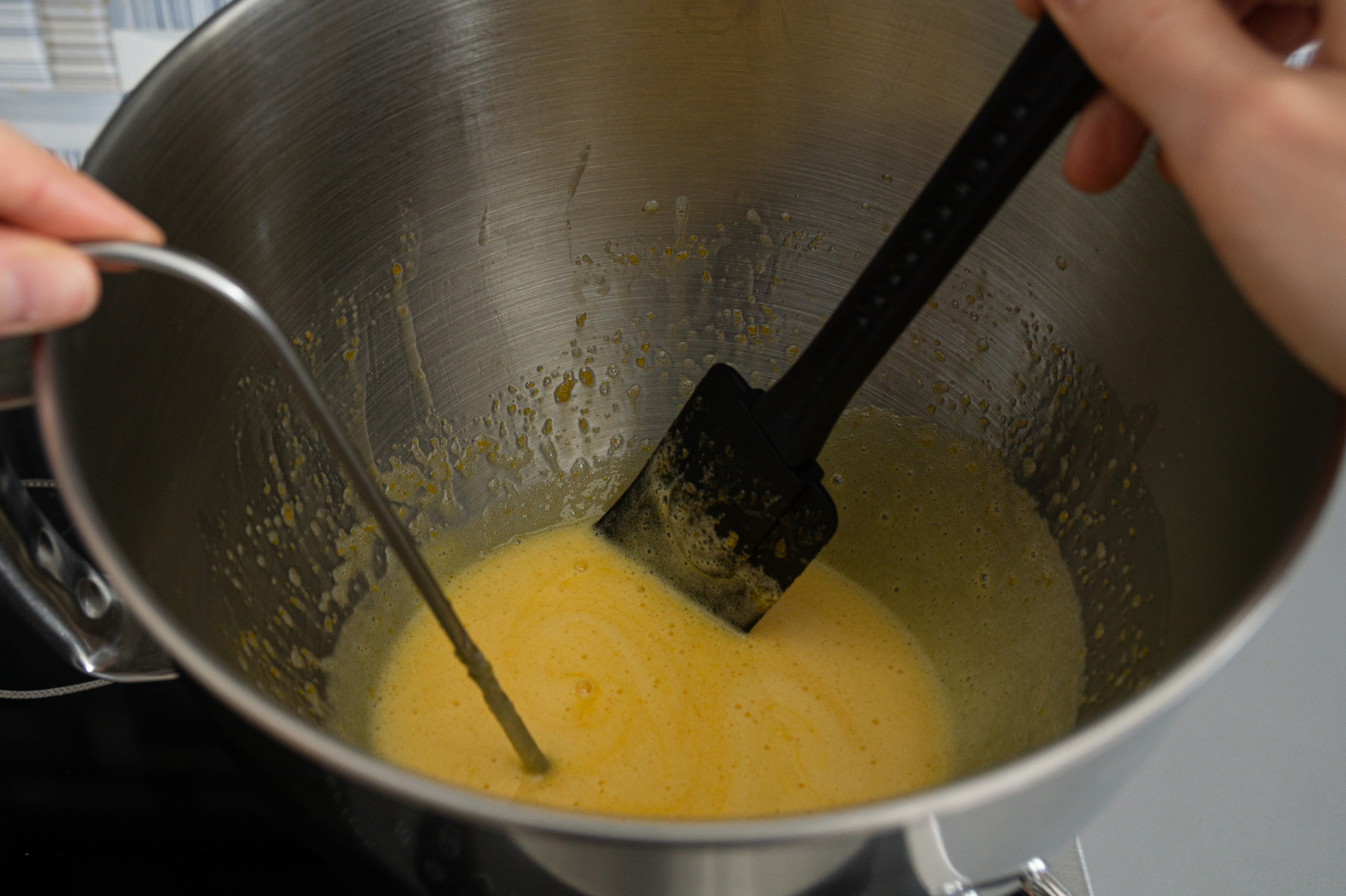 Heating and mixing egg yolks with sugar