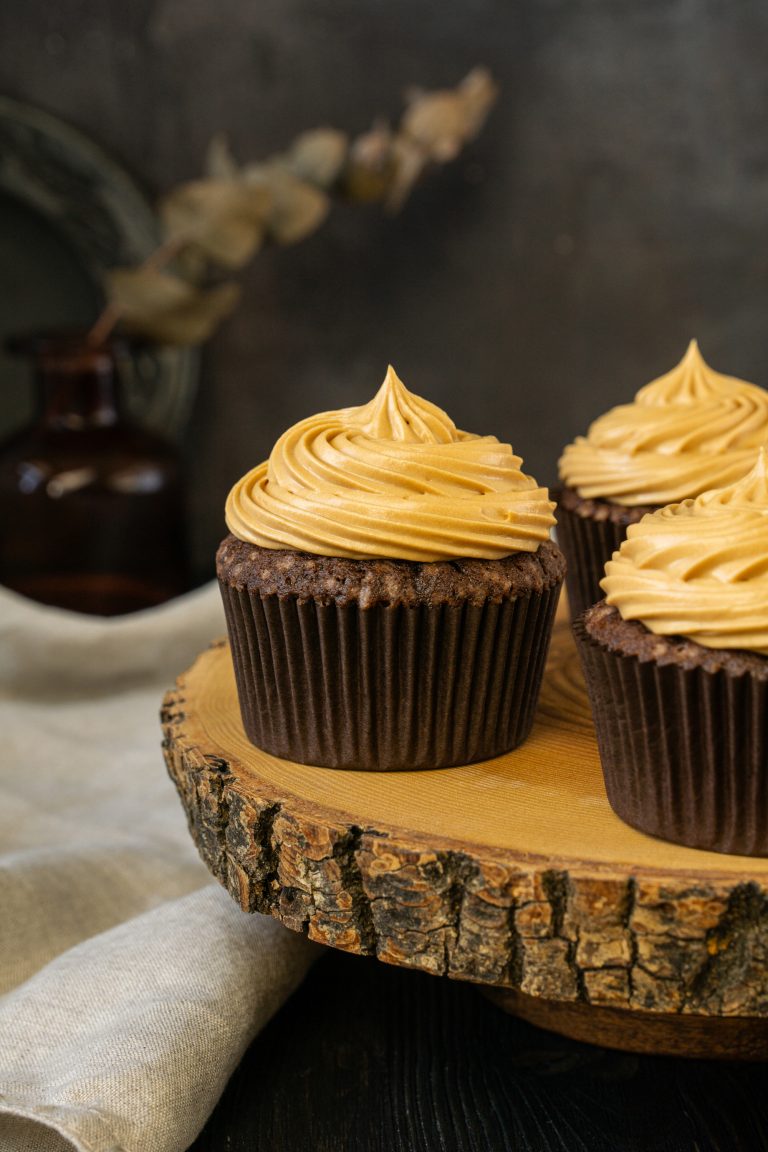 Close-up of chocolate caramel cupcake served on a wooden board