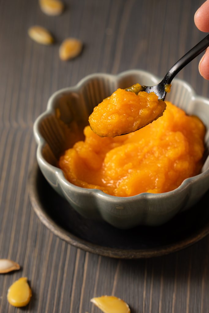 Close up of a bowl with homemade pumpkin puree that was not strained