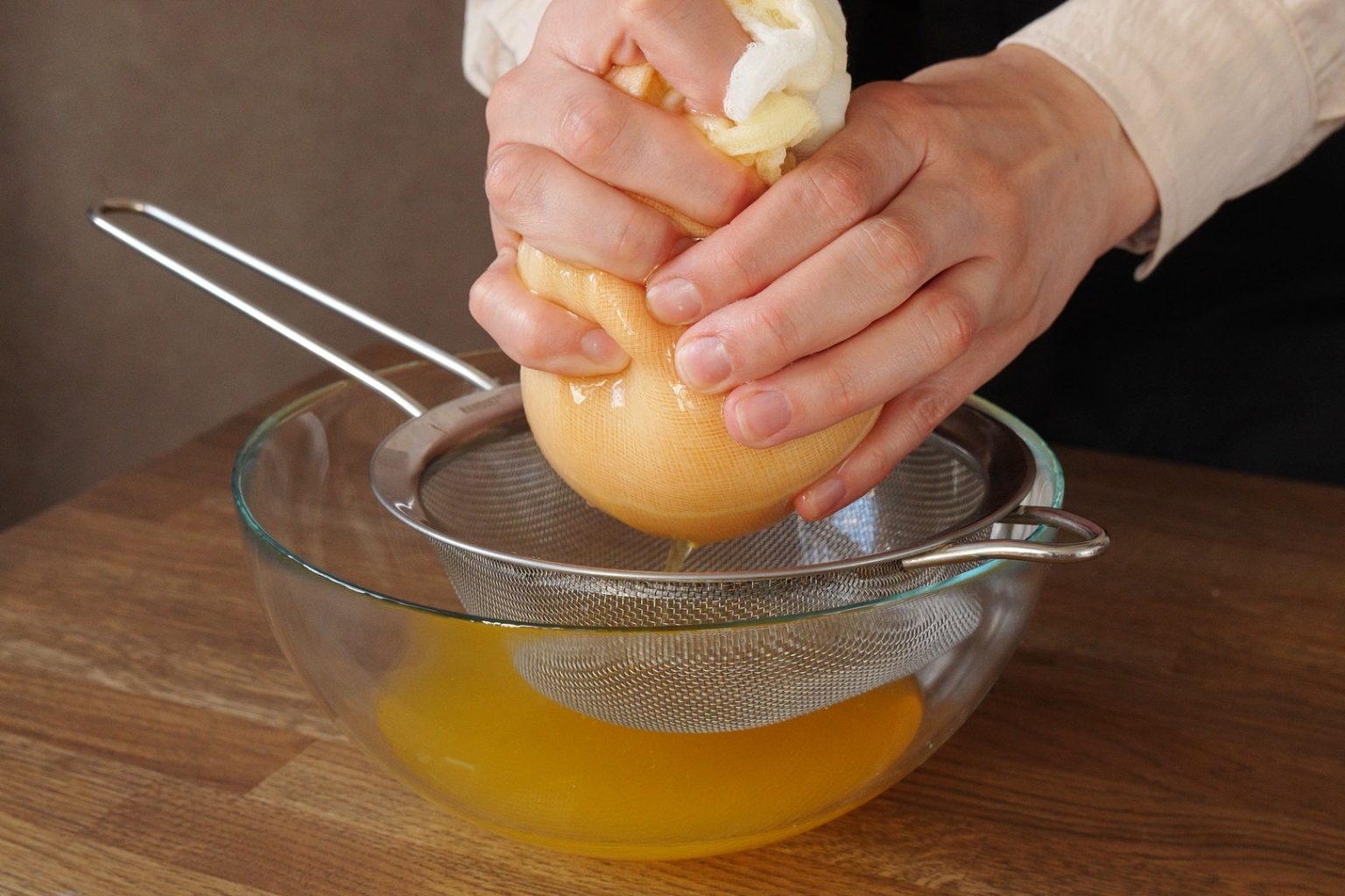 Pressing pumpkin puree to strain excess liquid out