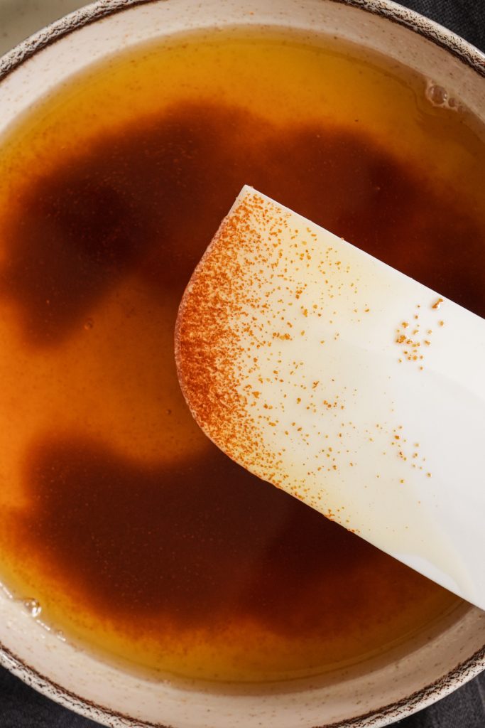 Close up of toasted milk solids in brown butter