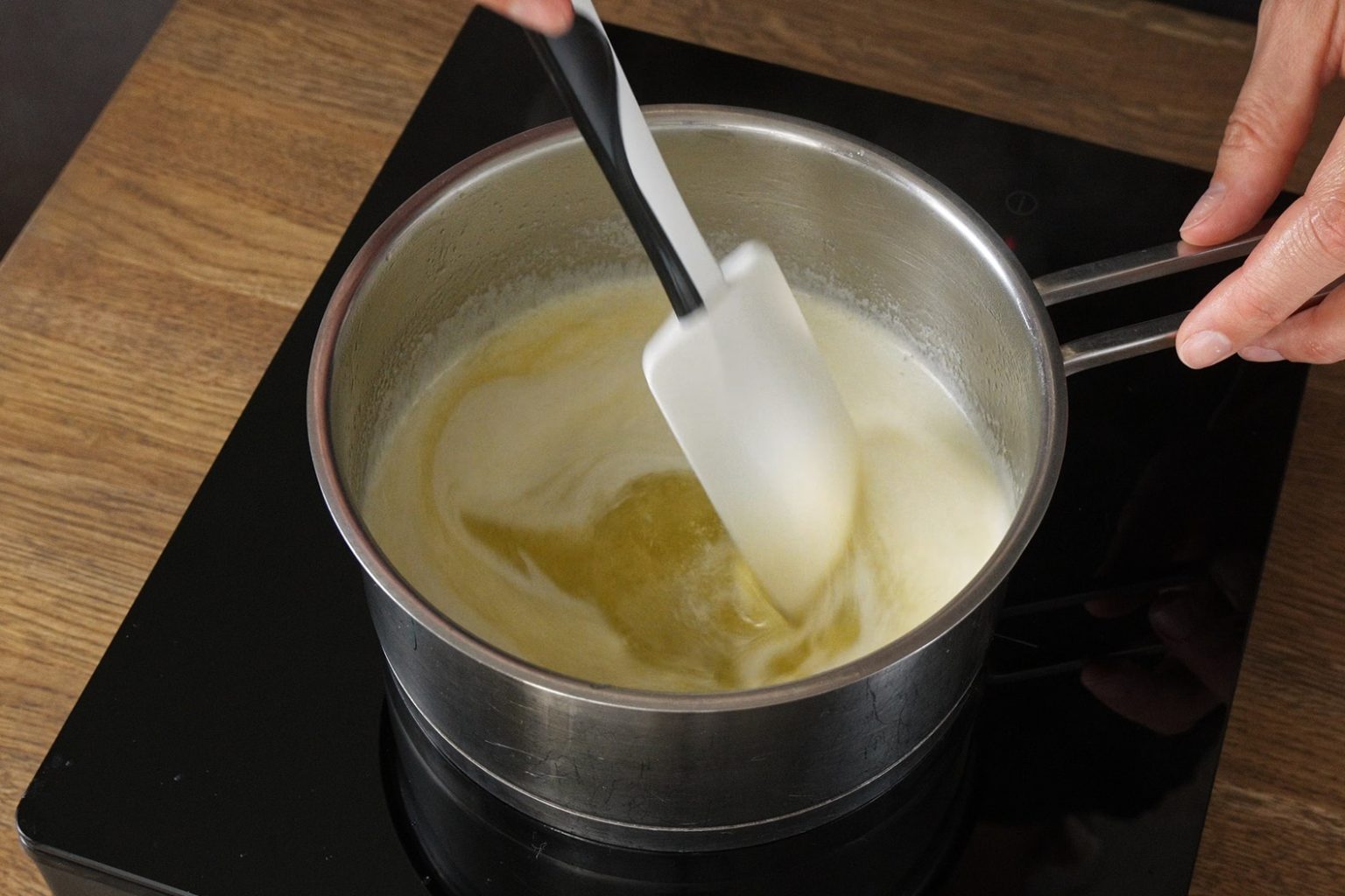 Melted butter in a saucepan with white foam on the surface