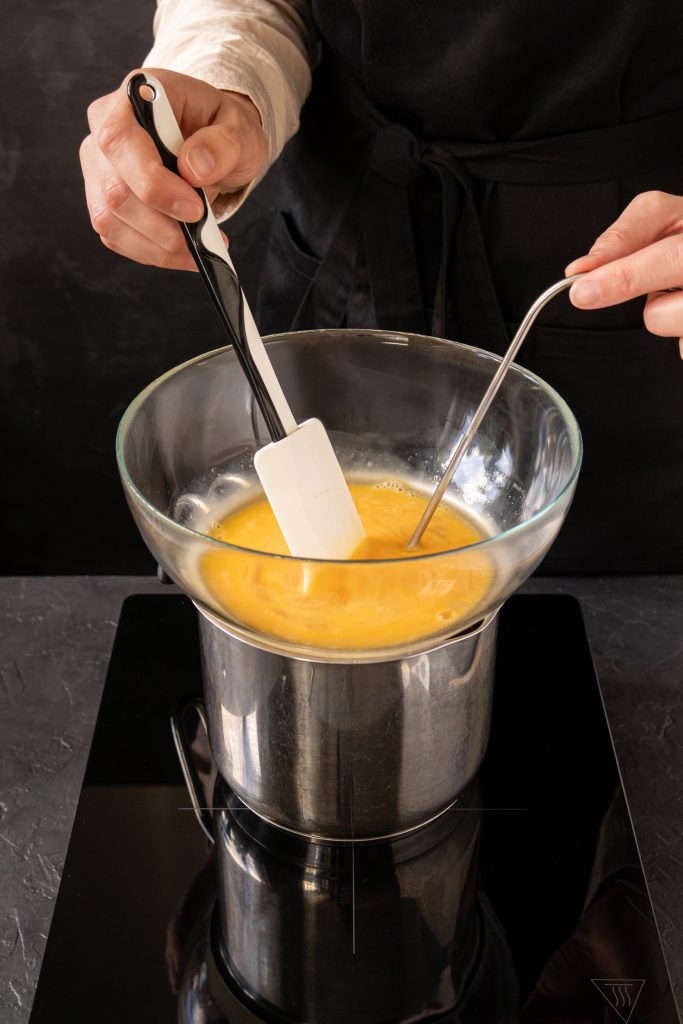 A woman pasteurizing liquid eggs at home