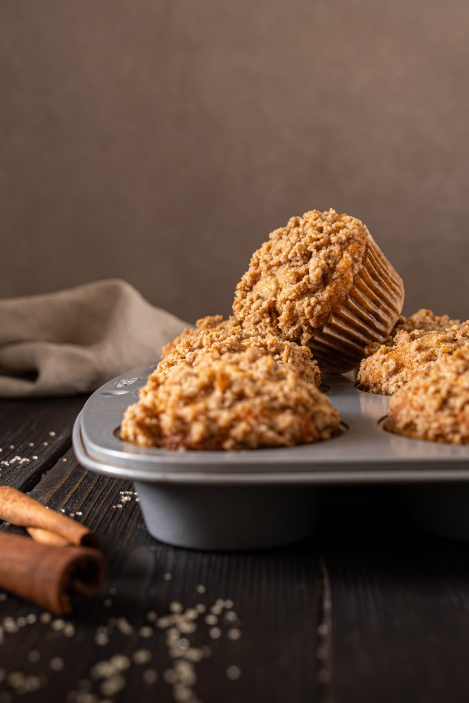 Brown butter apple muffins in a baking pan