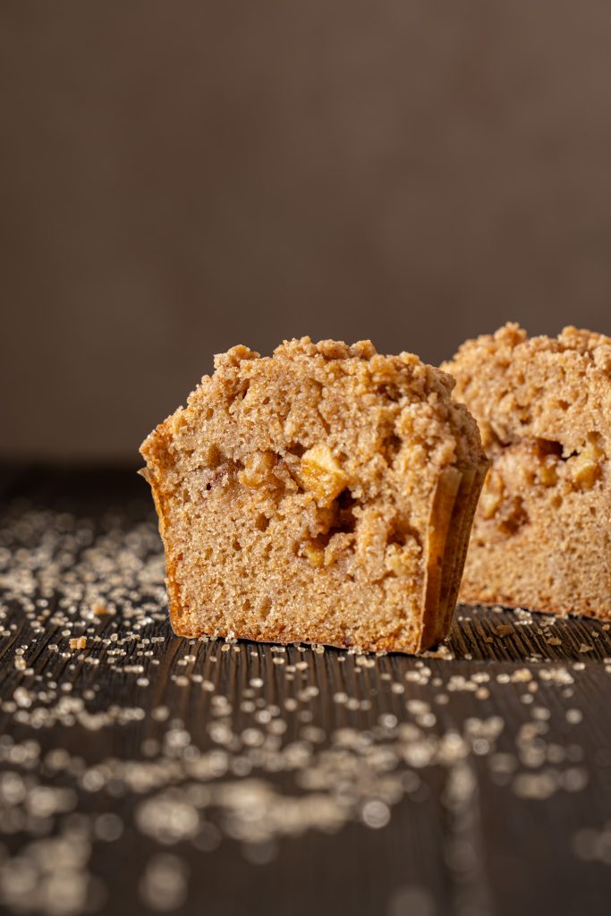 Close-up of a sliced brown butter apple muffin