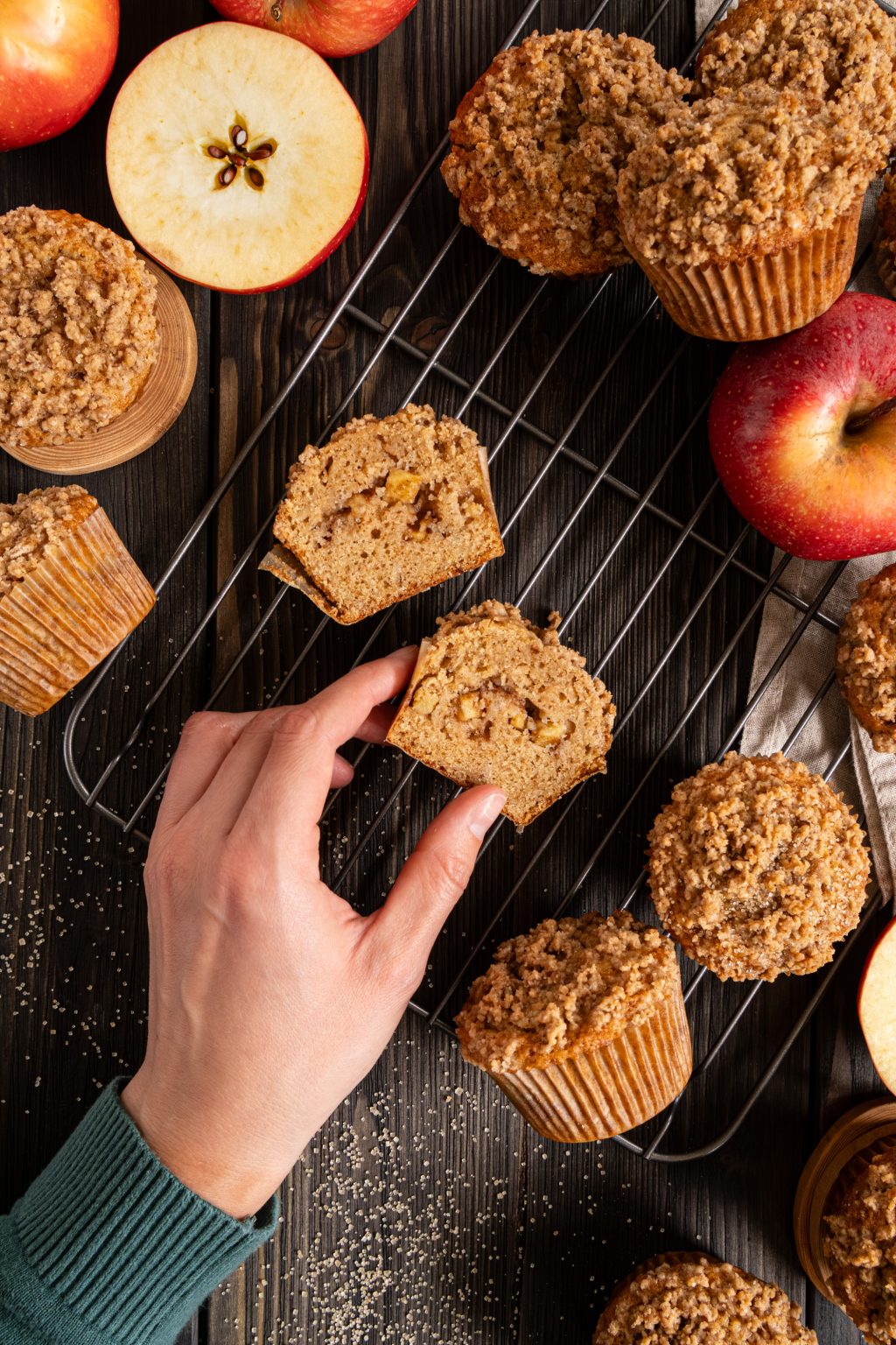 Top view of cut brown butter apple muffins served on a wooden table