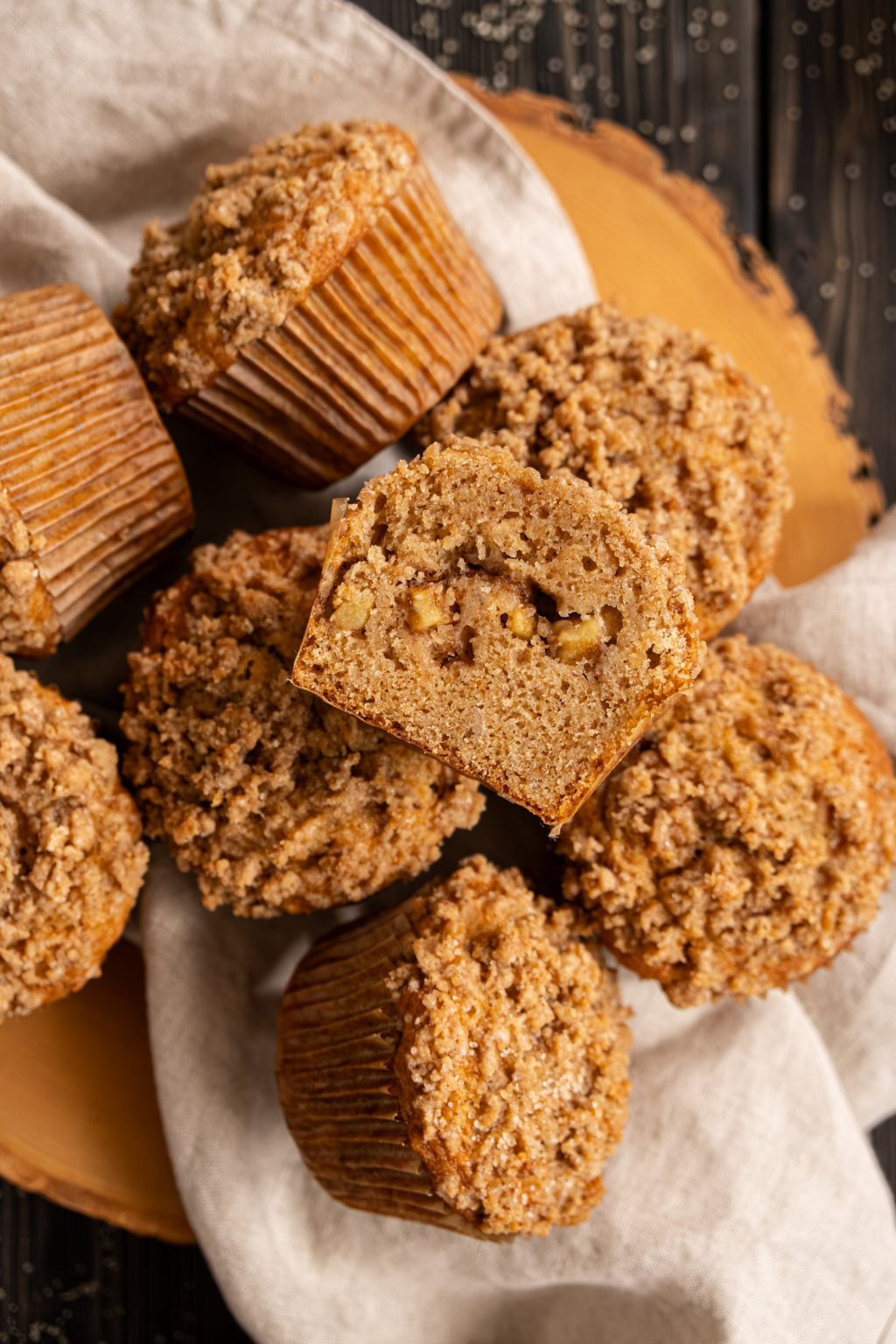 Close up of brown butter apple muffins served on a wooden table