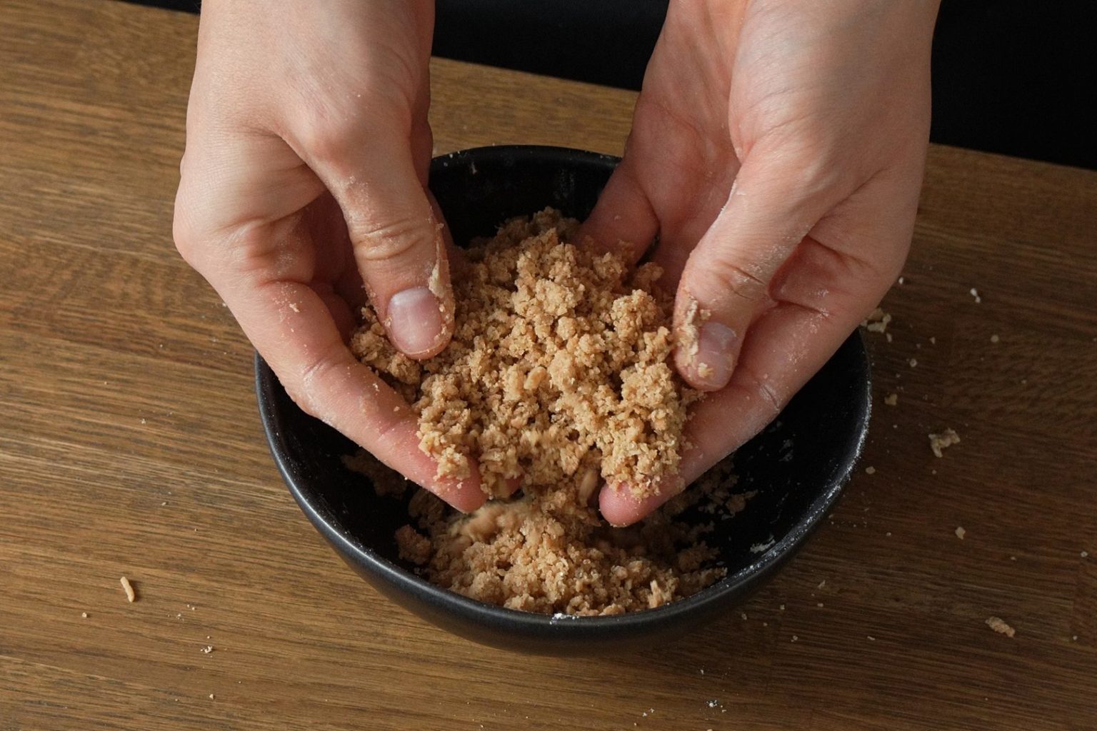 Freshly prepared crumble topping for brown butter apple muffins