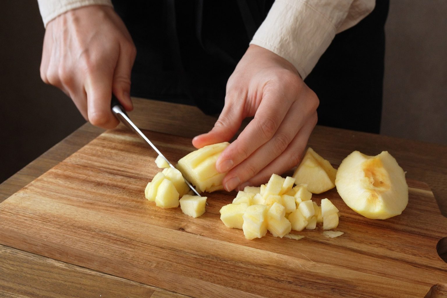 Cutting apples into cubes for apple muffin filling