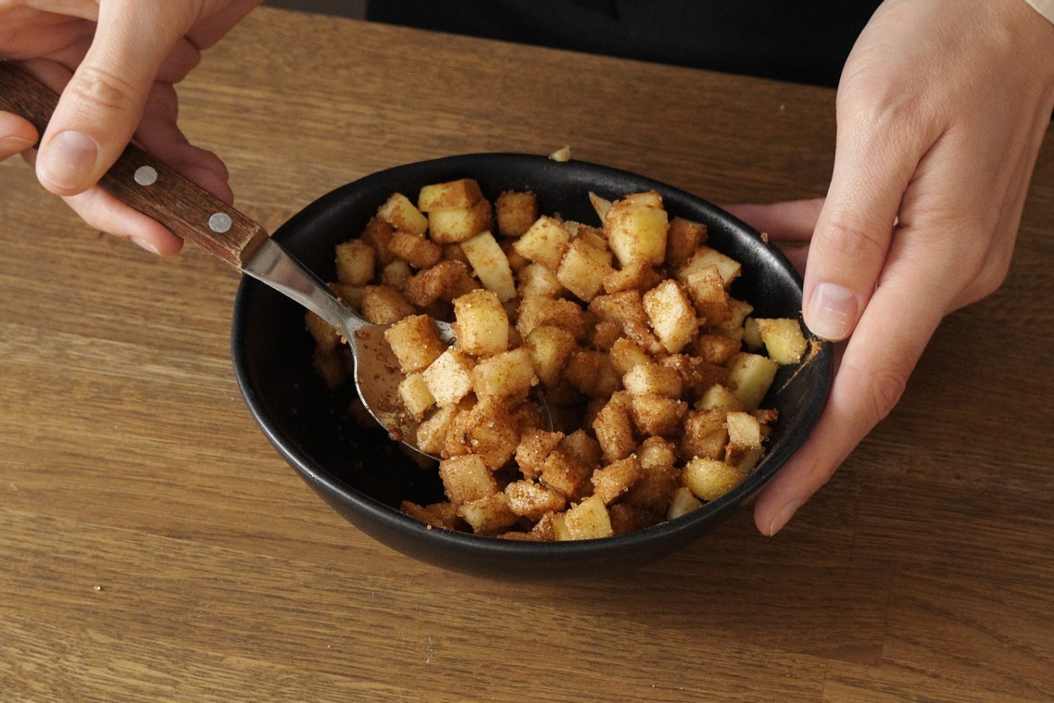 Cubed apples mixed with brown sugar and cinnamon