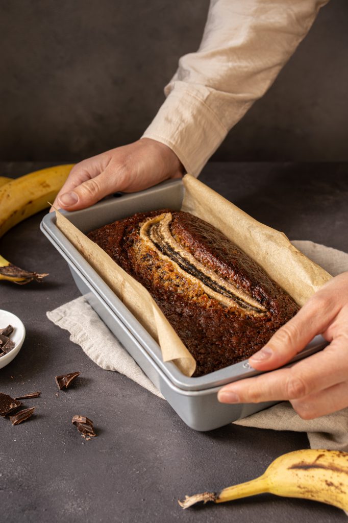 Freshly baked chocolate chip banana bread in a loaf pan