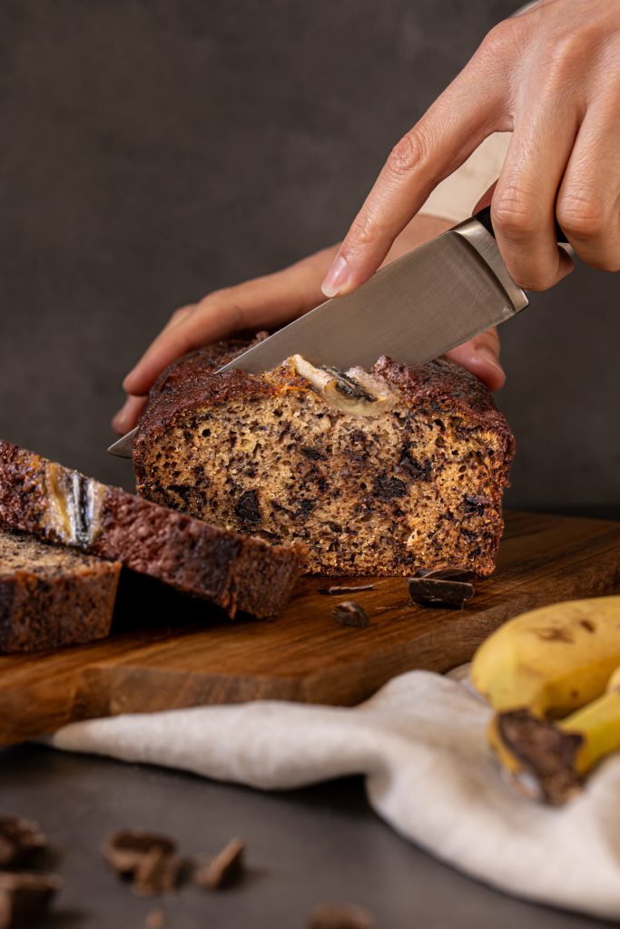Chocolate chip banana bread being sliced