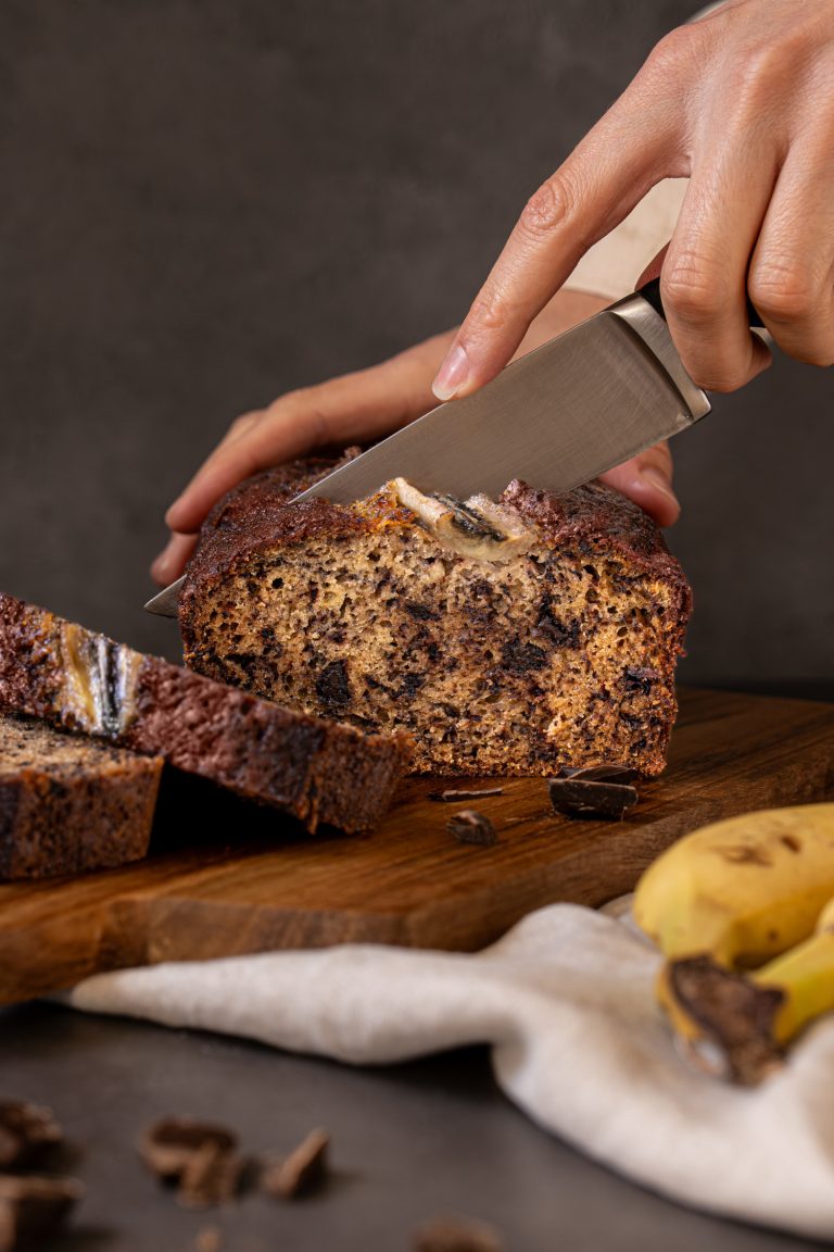 Chocolate chip banana bread being sliced
