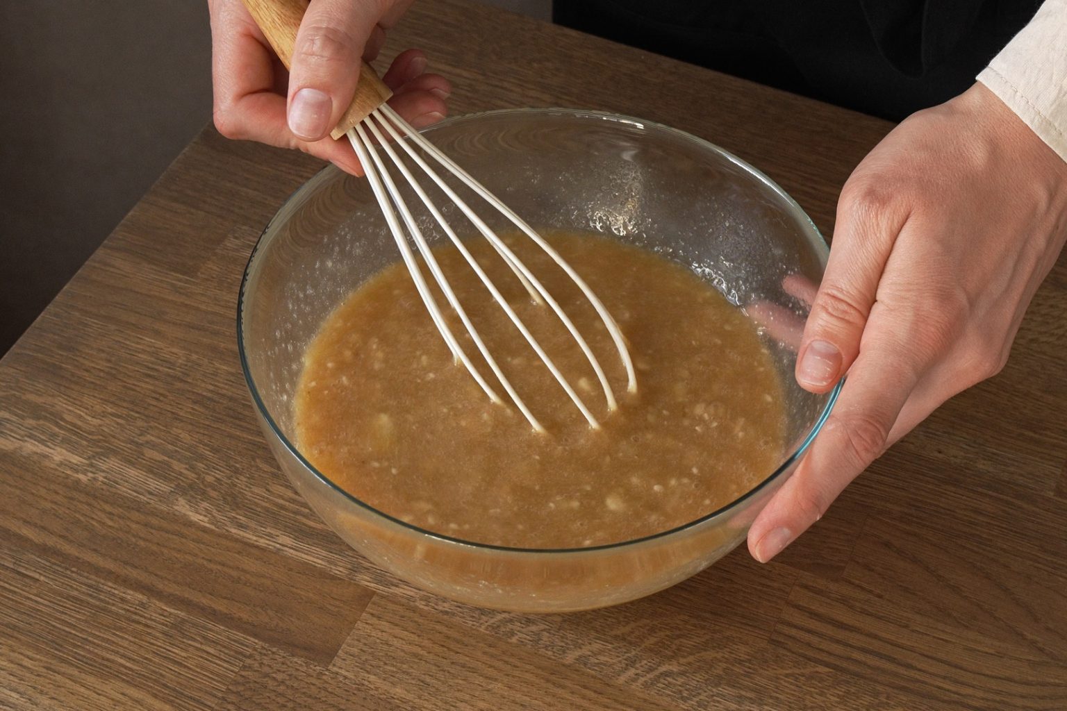 Mashed bananas mixed with brown sugar, eggs and vanilla extract