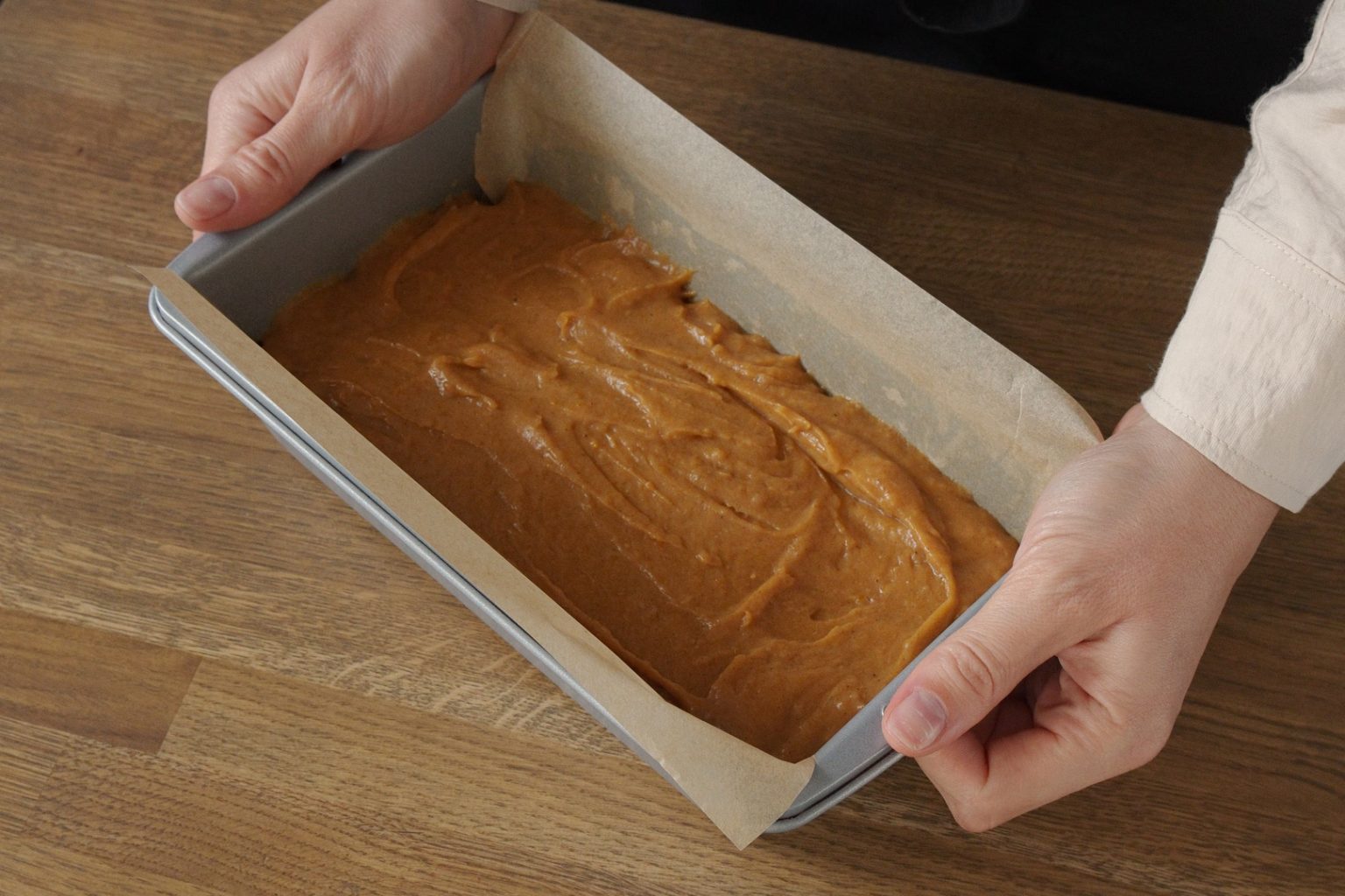 Pumpkin bread batter in a loaf pan ready to bake