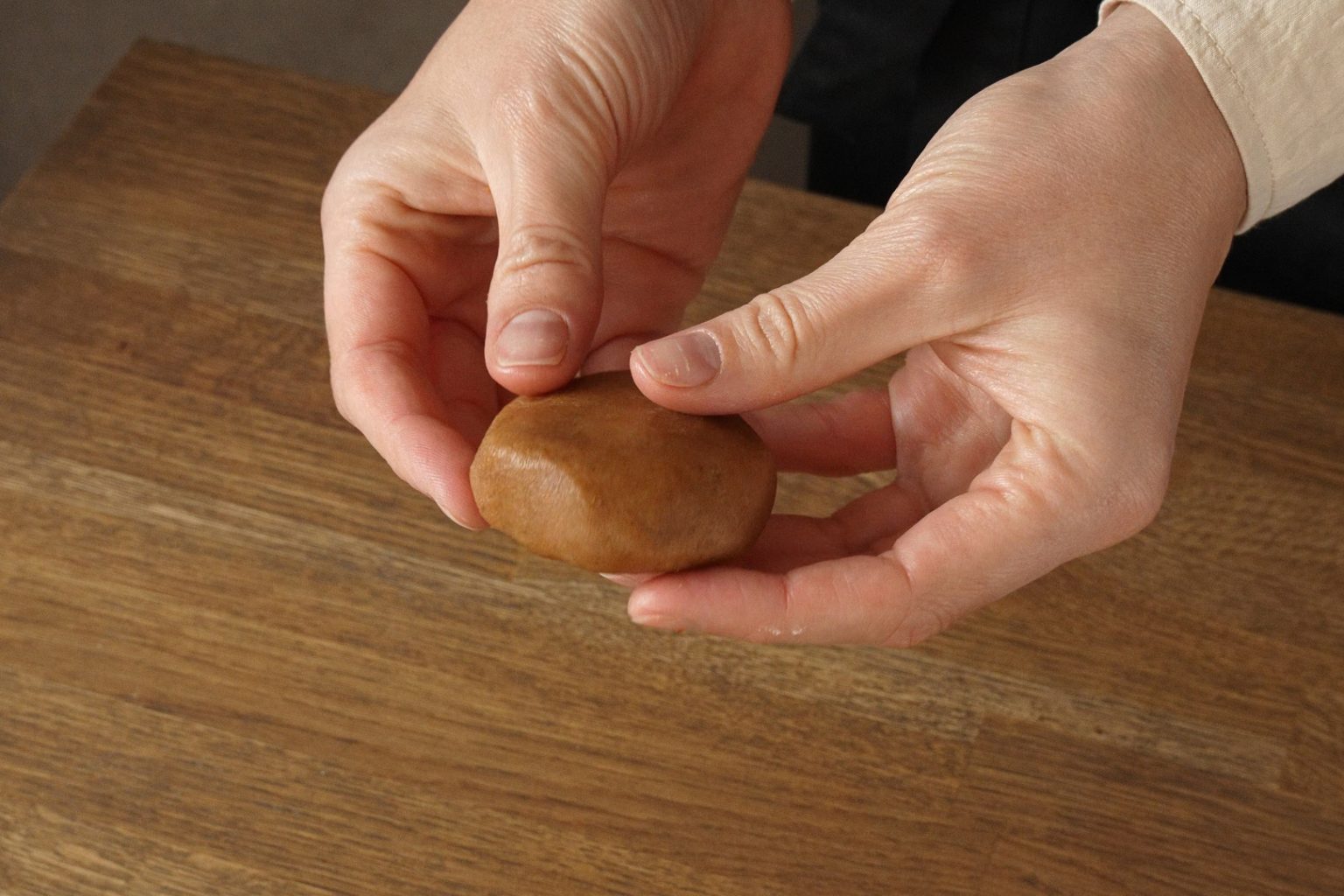 Brown butter pumpkin cookie dough shaped into flattened ball