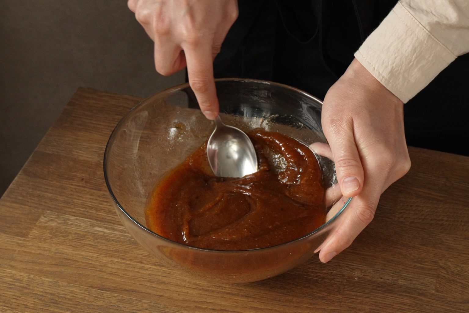 Smashing brown butter lamps with a spoon.