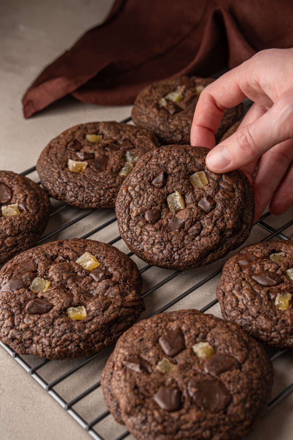 Chocolate ginger cookies on a cooling rack