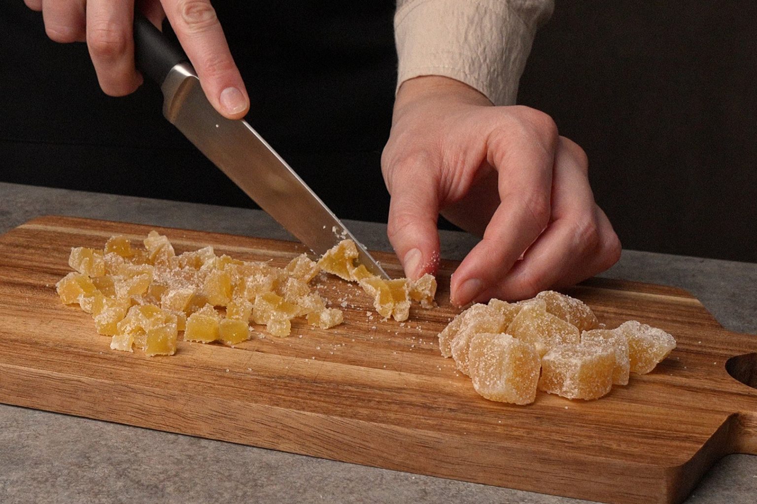Cutting crystallized ginger into smaller pieces